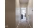 Hallway with carpeted floors, neutral paint, and access to the bedrooms at 9831 N Port Dr, McCordsville, IN 46055