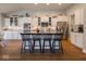 Modern kitchen features stainless steel appliances, granite countertops, and a stylish kitchen island at 9831 N Port Dr, McCordsville, IN 46055