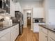 This kitchen features stainless steel appliances, granite countertops, and white cabinets at 9831 N Port Dr, McCordsville, IN 46055