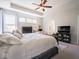 The main bedroom has carpet flooring and features a work space, dresser, and large bed at 9831 N Port Dr, McCordsville, IN 46055