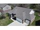 Aerial view of a home with a manicured lawn, and a two car garage at 9831 N Port Dr, McCordsville, IN 46055