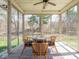 Enclosed sunroom offers a comfortable seating area with outdoor views at 9831 N Port Dr, McCordsville, IN 46055