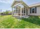 Inviting sunroom features ample natural light and cozy seating, perfect for relaxation and enjoying the outdoors at 9831 N Port Dr, McCordsville, IN 46055
