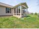 An enclosed sunroom with a view of the home's exterior, providing a tranquil space at 9831 N Port Dr, McCordsville, IN 46055