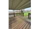 Covered wooden back deck overlooking backyard at 1010 Pamela Dr, Plainfield, IN 46168