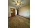 Bedroom featuring carpet, ceiling fan, and closet, offering a tranquil retreat at 1010 Pamela Dr, Plainfield, IN 46168