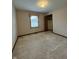 Bedroom featuring carpet, window, and closet, offering a cozy and functional space at 1010 Pamela Dr, Plainfield, IN 46168