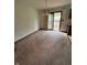 A dining room featuring a sliding door to a deck at 1010 Pamela Dr, Plainfield, IN 46168
