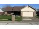Charming brick home featuring a covered front porch and an attached two-car garage at 1010 Pamela Dr, Plainfield, IN 46168