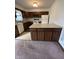 This kitchen features an island with storage and modern appliances at 1010 Pamela Dr, Plainfield, IN 46168