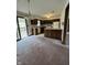 Functional kitchen area with wood cabinetry, countertop and access to deck at 1010 Pamela Dr, Plainfield, IN 46168