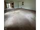 Spacious living area with carpet, large windows and access to the kitchen at 1010 Pamela Dr, Plainfield, IN 46168