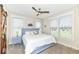 Inviting bedroom with abundant natural light, ceiling fan, and comfortable decor at 10151 E 191St St, Noblesville, IN 46060