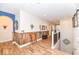 Hallway boasting a rustic accent wall and hardwood floors leading to arched doorways at 10151 E 191St St, Noblesville, IN 46060
