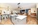 Open concept kitchen featuring a large island with a farmhouse sink, adjacent to the dining and living area at 10151 E 191St St, Noblesville, IN 46060