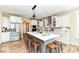 Bright kitchen showcases a central island with counter seating, stainless appliances, and ample storage at 10151 E 191St St, Noblesville, IN 46060