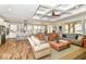 Bright, open-concept living space with a large kitchen island, coffered ceilings, and fireplace. Hardwood floors throughout at 10151 E 191St St, Noblesville, IN 46060