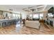 Bright, open-concept living space with a large kitchen island, coffered ceilings, and fireplace. Hardwood floors throughout at 10151 E 191St St, Noblesville, IN 46060