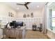 Home office featuring a built-in desk, neutral walls, and a ceiling fan for a comfortable workspace at 10151 E 191St St, Noblesville, IN 46060