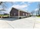 Large metal storage building with a wide concrete driveway, ideal for storage and workshop activities at 10151 E 191St St, Noblesville, IN 46060