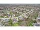 Expansive aerial view showcasing the residential neighborhood and tree-lined streets at 10157 Woods Edge Dr, Fishers, IN 46037