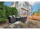 Inviting backyard seating area with comfortable chairs and a fire pit, ideal for gatherings and relaxation at 10157 Woods Edge Dr, Fishers, IN 46037