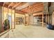 Unfinished basement with exposed wood framing and concrete flooring, ready for customization at 10157 Woods Edge Dr, Fishers, IN 46037