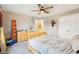 Bright bedroom with a dresser, large window, ceiling fan, and closet at 10157 Woods Edge Dr, Fishers, IN 46037
