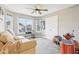 Versatile bonus room featuring a comfortable couch, large window, and a drum set for entertainment at 10157 Woods Edge Dr, Fishers, IN 46037