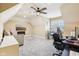 Upstairs bonus room with slanted ceilings, a TV on the wall, and a desk area at 10157 Woods Edge Dr, Fishers, IN 46037