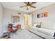 Bonus room with a drum set, comfortable couch with pillows, and artwork on the walls at 10157 Woods Edge Dr, Fishers, IN 46037