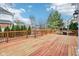 Spacious wooden deck with a wooden railing perfect for outdoor entertaining and relaxation on a sunny day at 10157 Woods Edge Dr, Fishers, IN 46037