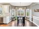 Charming dining area with a table set, surrounded by large windows and natural light at 10157 Woods Edge Dr, Fishers, IN 46037