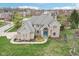 Brick facade home, blue door, and beautiful landscaping at 10157 Woods Edge Dr, Fishers, IN 46037