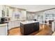Spacious kitchen with a center island, white cabinetry, and stainless steel appliances at 10157 Woods Edge Dr, Fishers, IN 46037