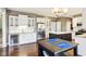 Modern kitchen featuring stainless steel appliances, a wine cooler, and a breakfast bar at 10157 Woods Edge Dr, Fishers, IN 46037