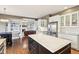 Open concept kitchen with an island, stainless steel appliances, and hardwood floors at 10157 Woods Edge Dr, Fishers, IN 46037