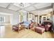 Open living room with hardwood floors, coffered ceilings, and an open floor plan at 10157 Woods Edge Dr, Fishers, IN 46037
