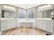 Luxurious bathroom with dual vanities, a standalone tub, and a decorative chandelier at 10157 Woods Edge Dr, Fishers, IN 46037
