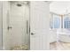 Bright main bathroom featuring walk-in shower and separate bathtub at 10157 Woods Edge Dr, Fishers, IN 46037