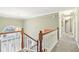 Grand staircase with wooden railings and white balusters leading to the second floor at 10157 Woods Edge Dr, Fishers, IN 46037