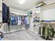 Organized walk-in closet with multiple shelves and hanging racks for ample storage at 10157 Woods Edge Dr, Fishers, IN 46037