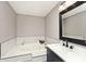 Bright bathroom with a soaking tub and classic design at 10234 Leeward Blvd, Indianapolis, IN 46256