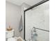 Modern bathroom with a shower, toilet, and storage at 10234 Leeward Blvd, Indianapolis, IN 46256