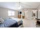 Bright bedroom with neutral walls, large window, and spacious carpeted floor at 10234 Leeward Blvd, Indianapolis, IN 46256