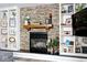 The living room features a stone fireplace with wooden mantle and built-in white bookshelves at 10234 Leeward Blvd, Indianapolis, IN 46256