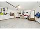 Spacious three car garage featuring epoxy flooring and ample room for storage at 10234 Leeward Blvd, Indianapolis, IN 46256