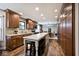 Open kitchen with wood floors, cabinets, a large island and stainless steel appliances at 10234 Leeward Blvd, Indianapolis, IN 46256
