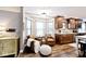 Cozy eat-in kitchen features wood cabinets, stainless steel appliances, and a seating area at 10234 Leeward Blvd, Indianapolis, IN 46256