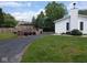 A spacious backyard with a wooden deck, patio, and lush lawn at 1024 Foltz St, Indianapolis, IN 46241